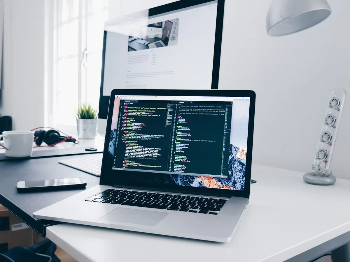 Developer workstation with code on screen